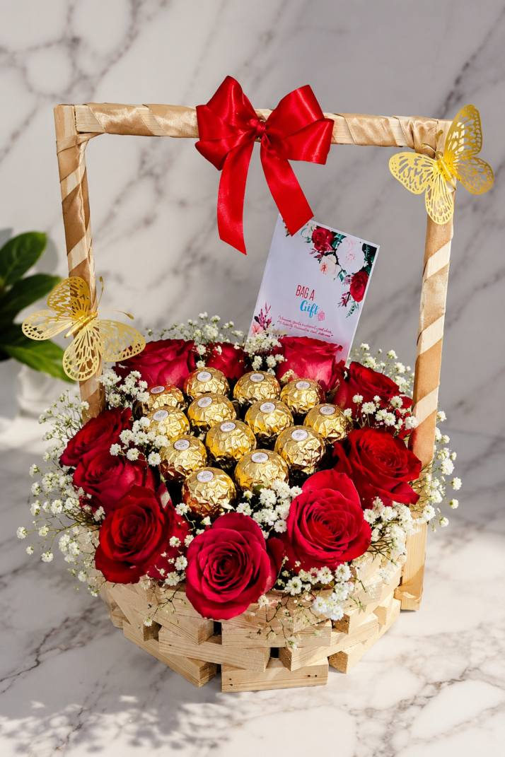 10 red roses with gypsophilla with 12 ferreros in a basket