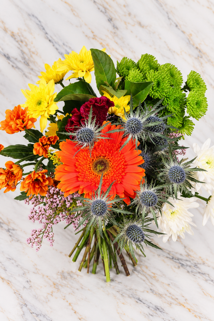 Citrus Meadow Bouquet with orange gerbera, chrysanthemums and blue thistle
